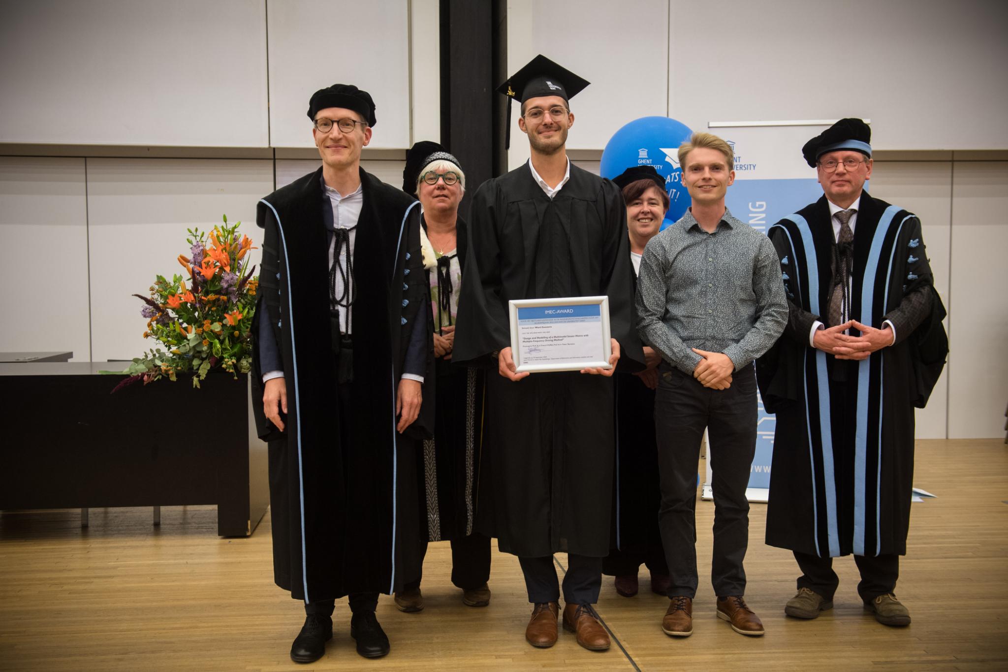 Ward with his prize at the 2024 graduation ceremony.